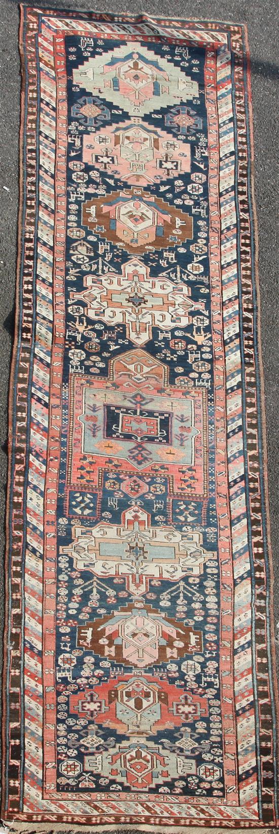 A Shirvan blue ground runner, c.1900, 15ft 6in by 3ft 7in.